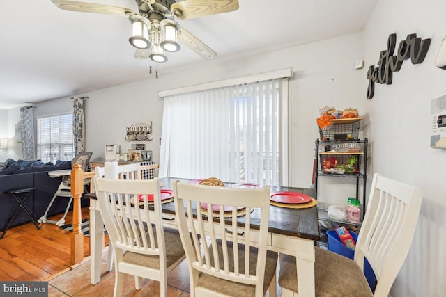 dining room featuring a ceiling fan and wood finished floors