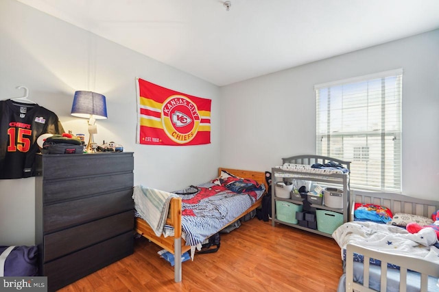 bedroom featuring wood finished floors