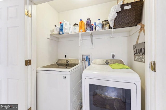 washroom with washer and dryer and laundry area