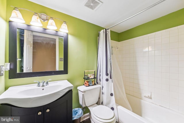 bathroom with visible vents, toilet, vanity, and shower / bath combination with curtain
