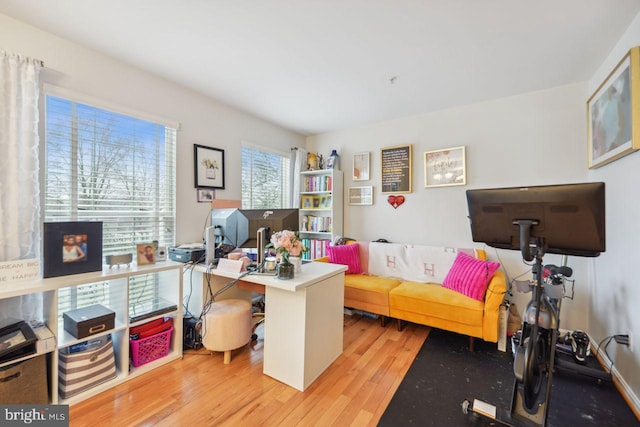 home office with wood finished floors