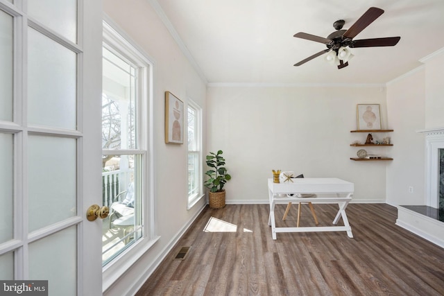 interior space featuring a fireplace with raised hearth, visible vents, and ceiling fan