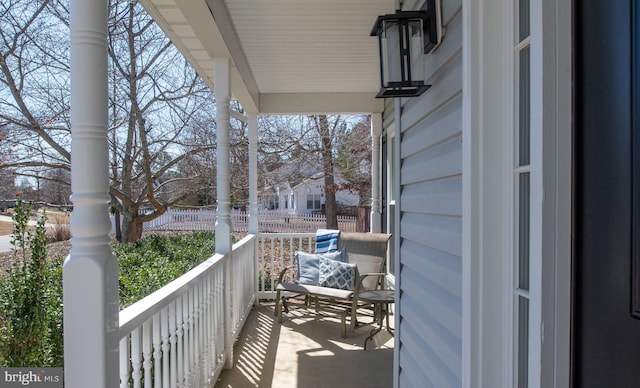 balcony featuring a porch