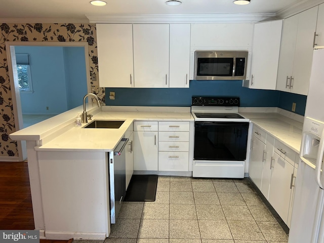 kitchen with white refrigerator with ice dispenser, range with electric cooktop, stainless steel microwave, ornamental molding, and a sink