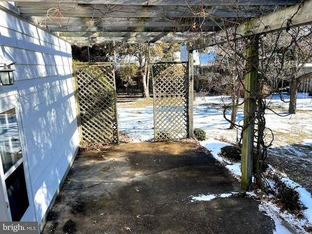 snow covered patio with fence