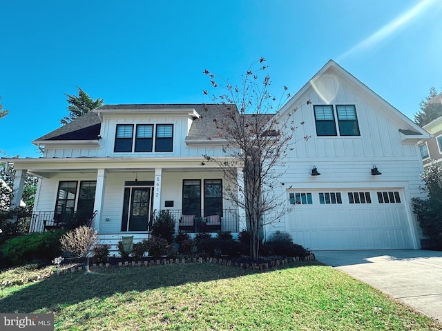 view of front of property featuring a shingled roof, concrete driveway, a front yard, covered porch, and an attached garage