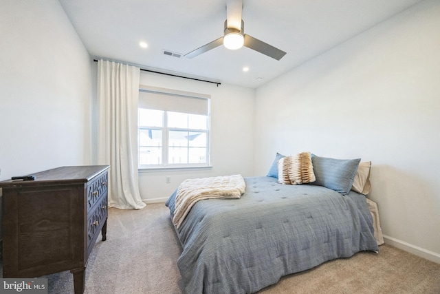 carpeted bedroom with recessed lighting, visible vents, and baseboards