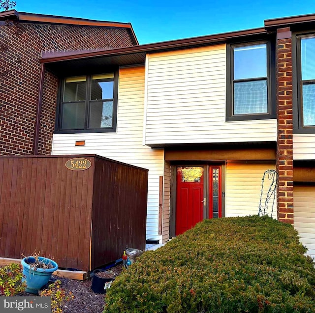 view of front of home featuring brick siding