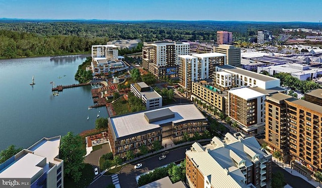 birds eye view of property featuring a water view and a view of city