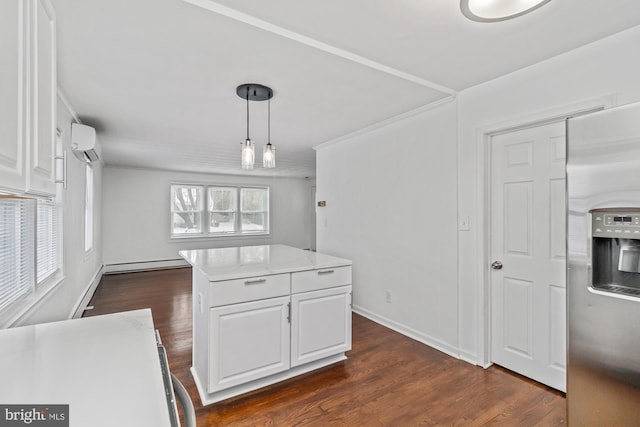 kitchen featuring a baseboard heating unit, a wall unit AC, white cabinets, and stainless steel refrigerator with ice dispenser