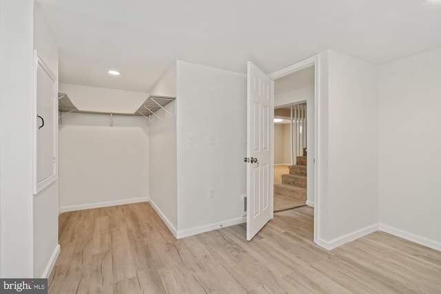 spacious closet with wood finished floors