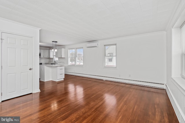 unfurnished living room with a baseboard heating unit, dark wood finished floors, crown molding, and a wall mounted AC