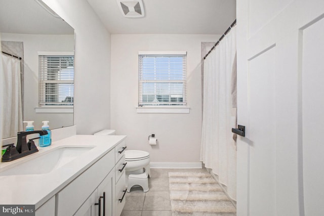 full bathroom with tile patterned flooring, baseboards, vanity, and toilet