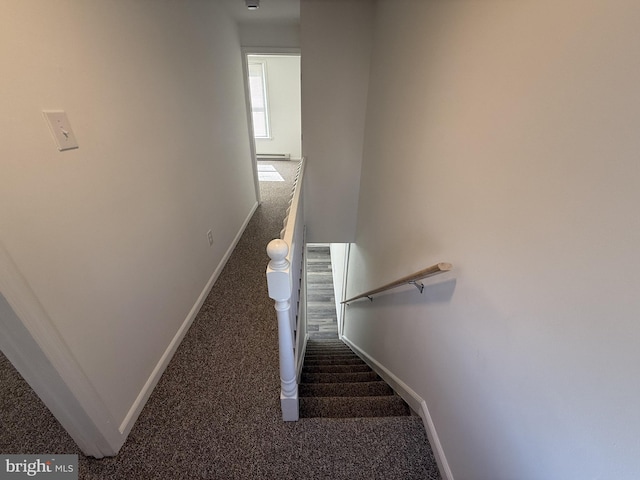 staircase with carpet and baseboards