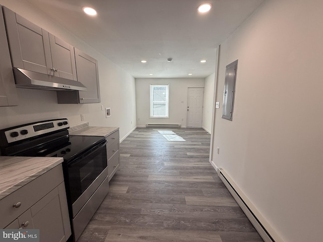 kitchen with under cabinet range hood, baseboard heating, electric stove, and gray cabinetry