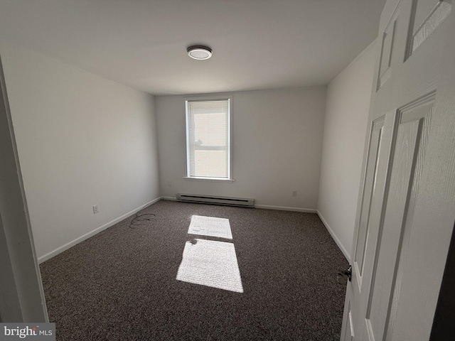 spare room with baseboards, baseboard heating, and carpet flooring