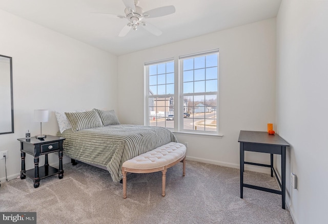 bedroom featuring carpet flooring, a ceiling fan, and baseboards