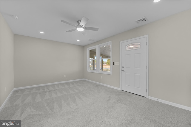 carpeted spare room with a ceiling fan, recessed lighting, visible vents, and baseboards