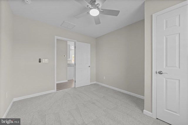 unfurnished bedroom featuring carpet floors, ceiling fan, and baseboards