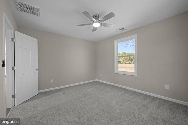 unfurnished bedroom featuring a ceiling fan, baseboards, visible vents, and carpet flooring