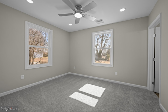 unfurnished bedroom featuring recessed lighting, carpet, visible vents, and baseboards