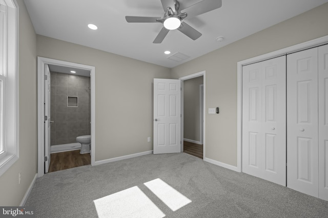 unfurnished bedroom with carpet, a closet, baseboards, and recessed lighting