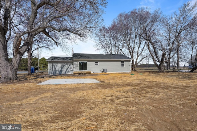 back of property featuring central AC and a patio