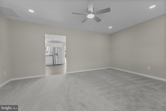 unfurnished room with recessed lighting, visible vents, baseboards, and light colored carpet