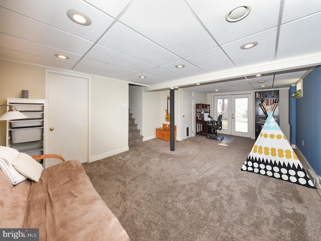 game room with french doors, carpet, a drop ceiling, and baseboards