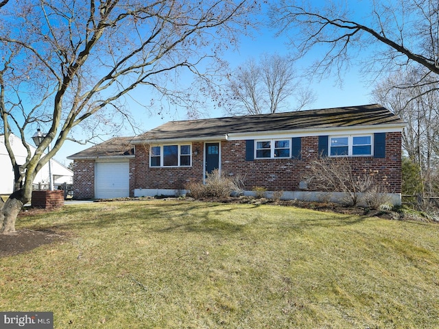 ranch-style home with a garage, brick siding, and a front lawn