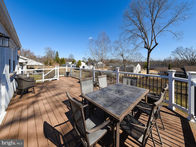 wooden deck featuring outdoor dining space