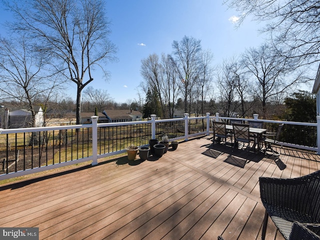 deck featuring outdoor dining area