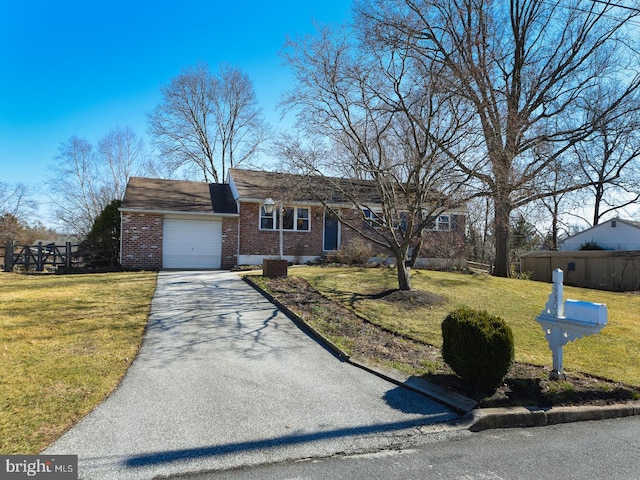 view of front of house featuring driveway, brick siding, an attached garage, and a front yard