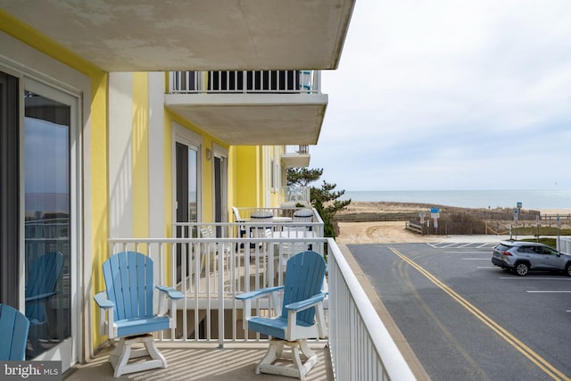 balcony featuring a water view