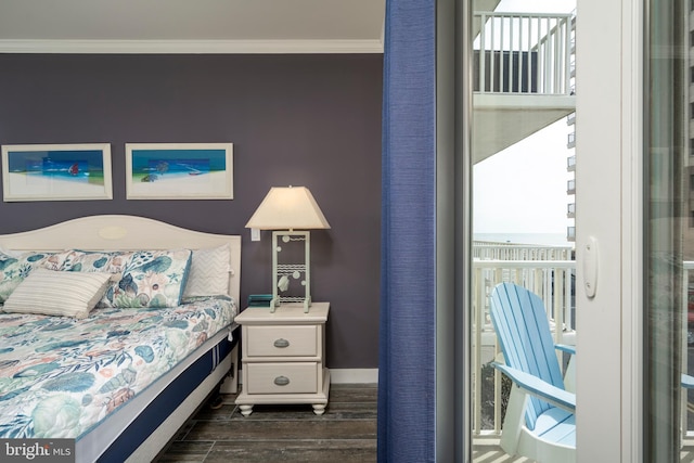 bedroom featuring ornamental molding and wood finish floors