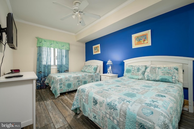 bedroom with crown molding, ceiling fan, and wood finished floors