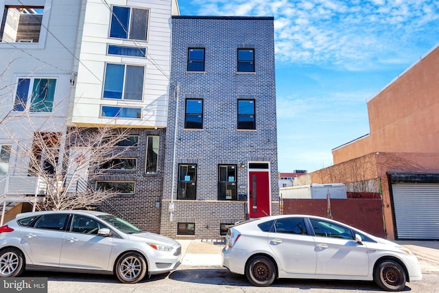 view of front of home featuring brick siding