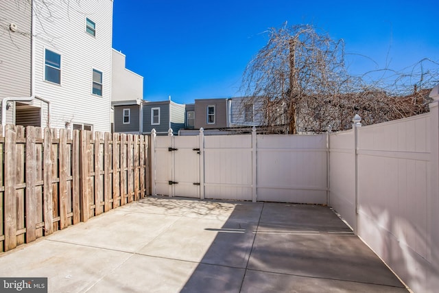 view of patio / terrace featuring a gate and fence