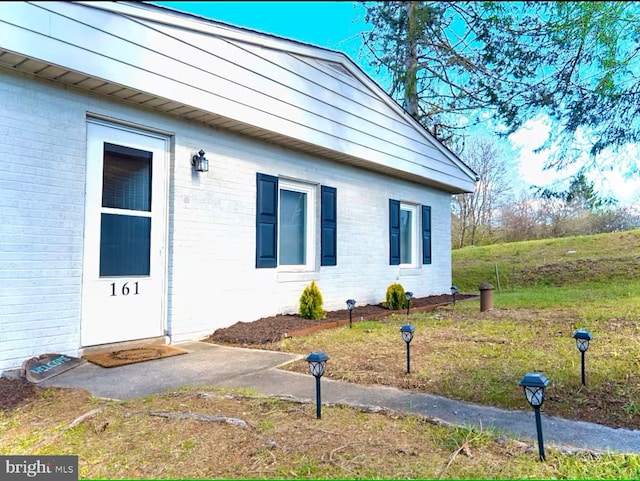 view of home's exterior featuring brick siding