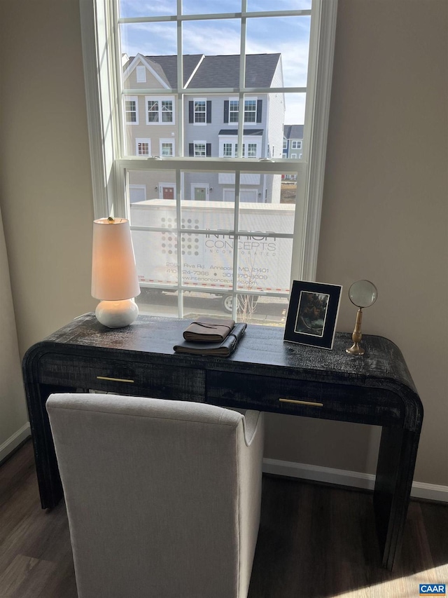 office area with wood finished floors and baseboards