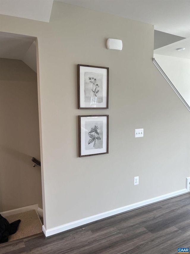 interior space featuring wood finished floors and baseboards