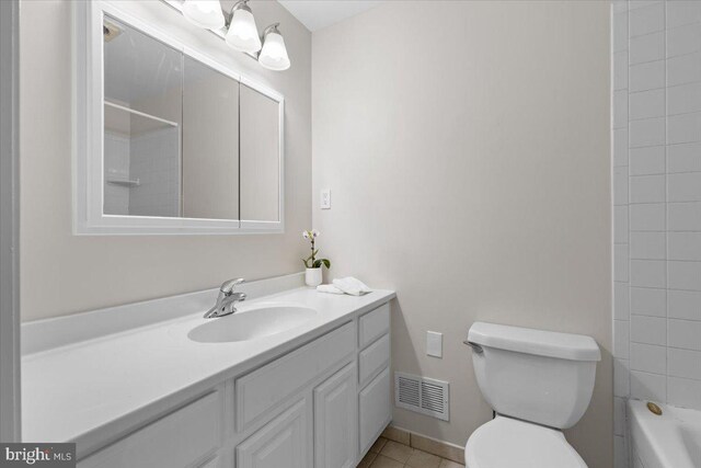 38577 Goose Creek Ln, Leesburg, VA 20175 - bathroom featuring vanity, toilet, tile patterned flooring, baseboards, and shower / tub combination
