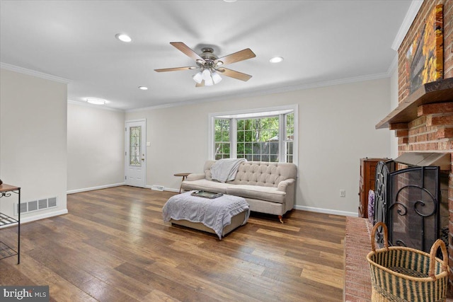 38577 Goose Creek Ln, Leesburg, VA 20175 - living room featuring baseboards, wood finished floors, a ceiling fan, crown molding, and a fireplace