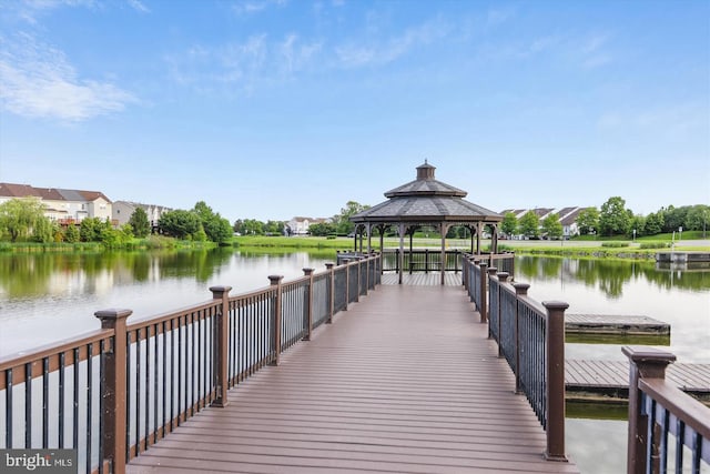 dock area with a gazebo and a water view