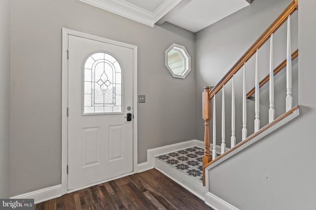 entrance foyer with baseboards, dark wood finished floors, and crown molding