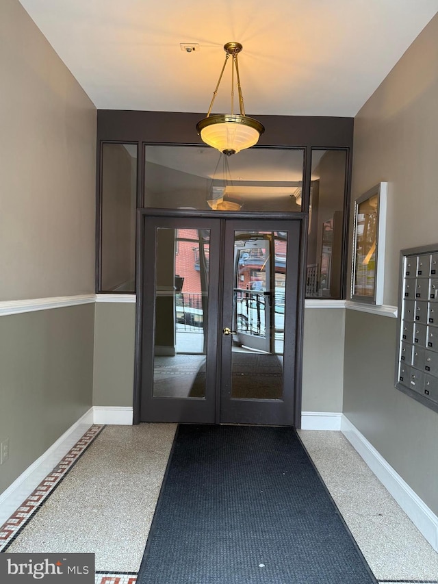 property entrance featuring french doors