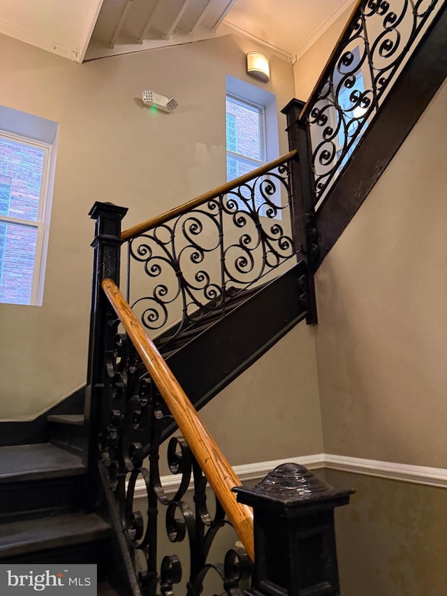 stairway with crown molding
