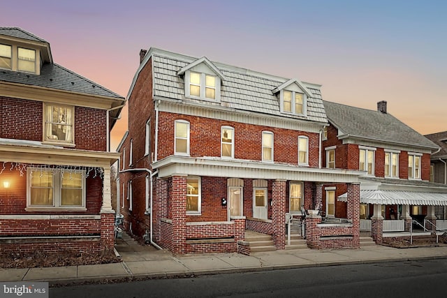 view of front of house with brick siding