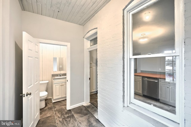 bathroom with vanity, toilet, and wood ceiling