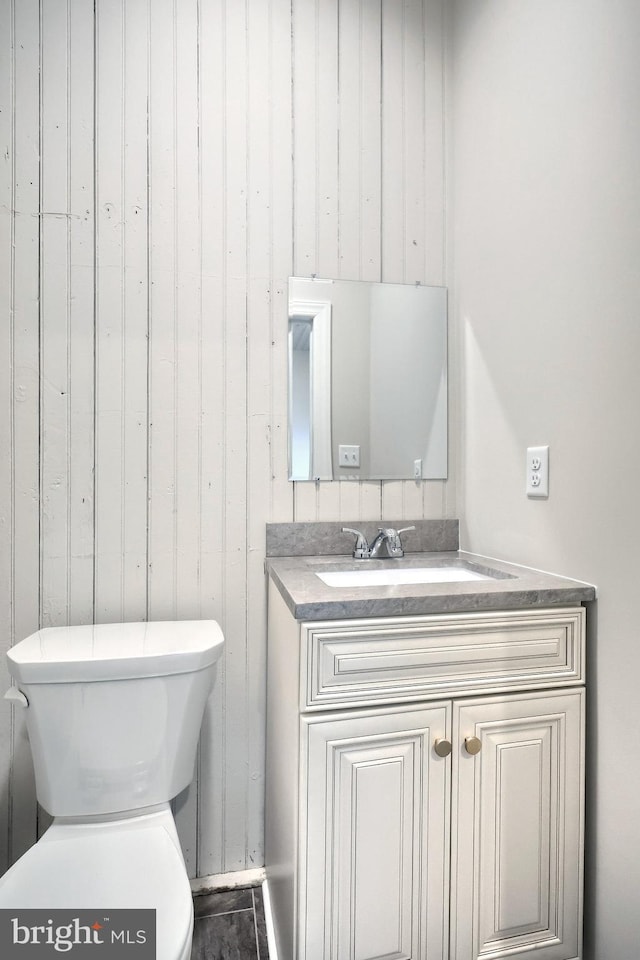 bathroom featuring toilet and vanity